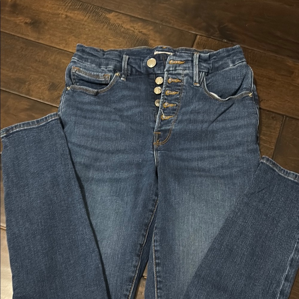 Good American exposed button jeans